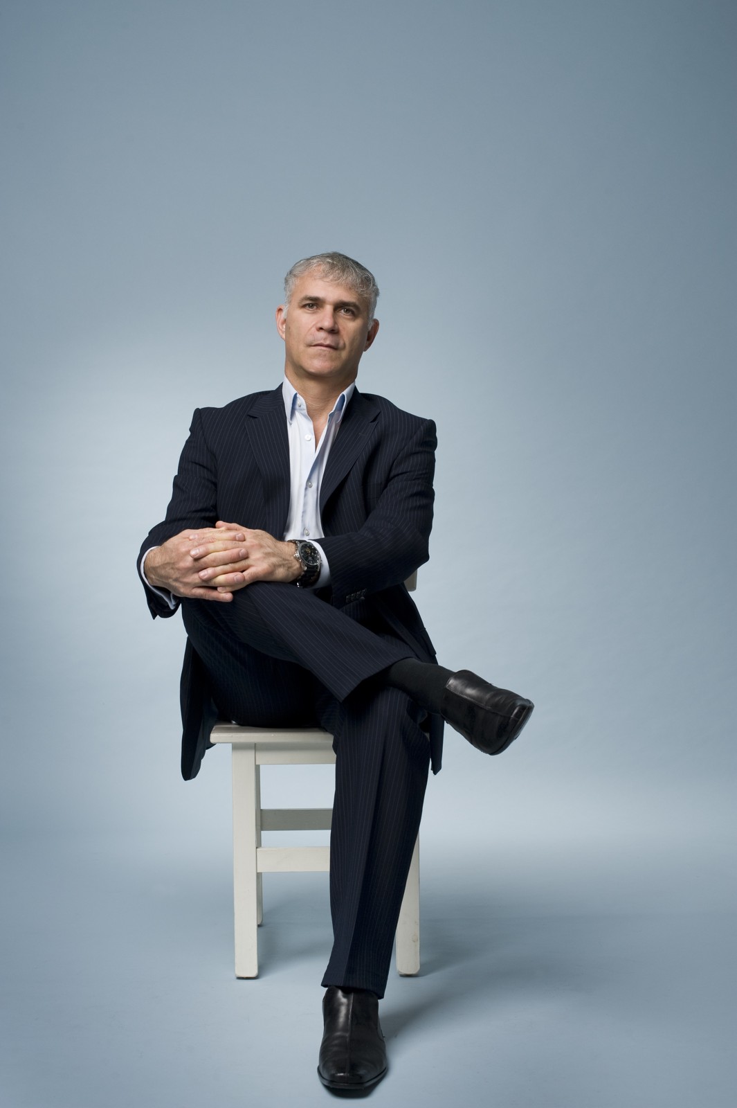 FIMI founder Ishay Davidi seated in an archival portrait.